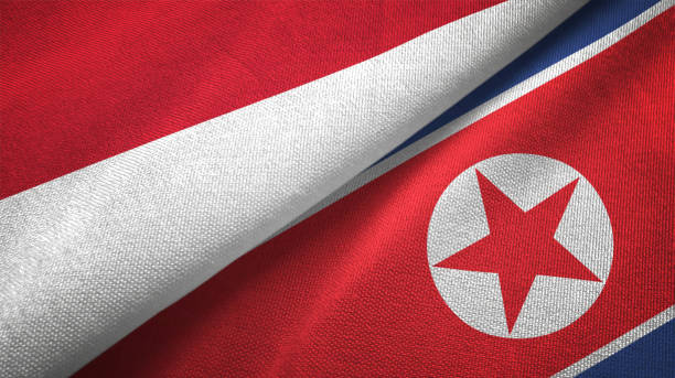 istock North Korea and Indonesia two flags together textile cloth, fabric texture 1125758940