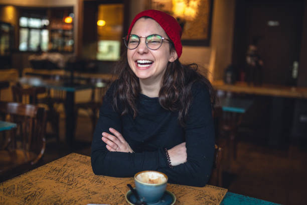 istock Smiling student girl at a coffee shop 1125759773