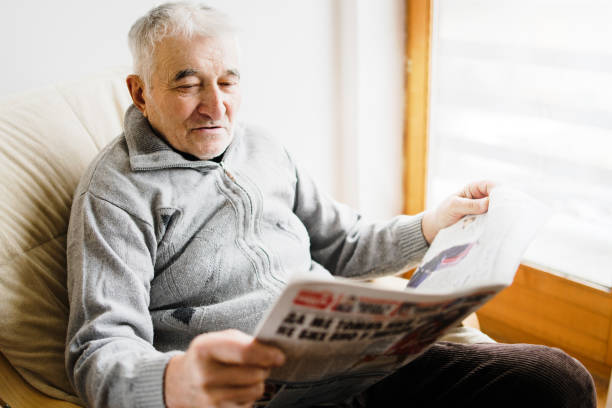 istock Senior Man Reading Papers At Nursing Home 1125761811