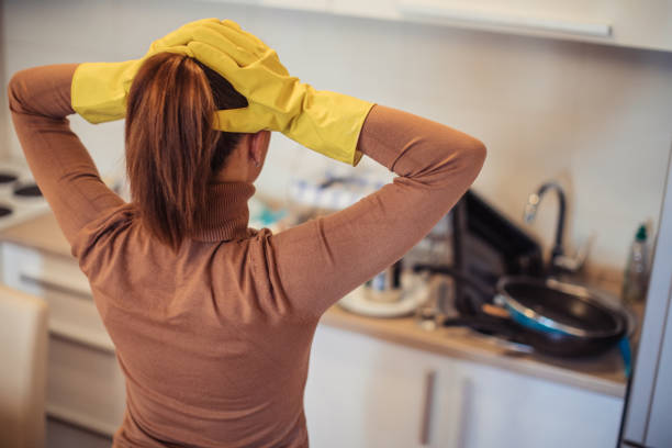 istock Headache from the sink full with dirty dishes 1125762884