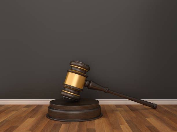 istock Gavel on Wood Floor - 3D Rendering 1125764644