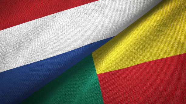 istock Benin and Netherlands two flags together textile cloth, fabric texture 1125772733