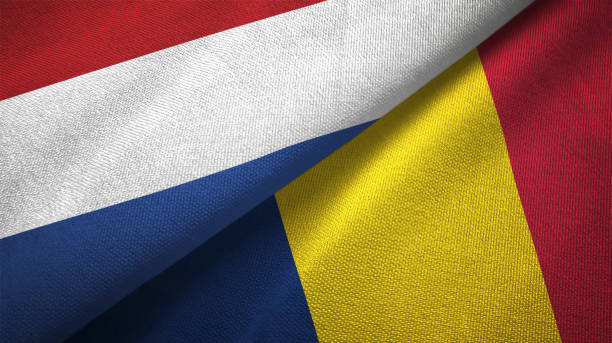 istock Chad and Netherlands two flags together textile cloth, fabric texture 1125772752