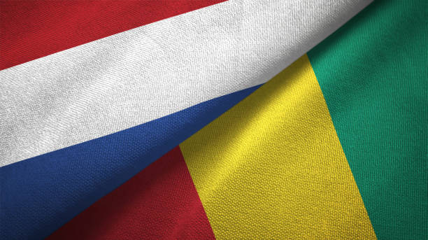 istock Guinea and Netherlands two flags together textile cloth, fabric texture 1125772821