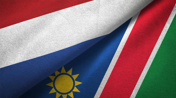istock Namibia and Netherlands two flags together textile cloth, fabric texture 1125772925
