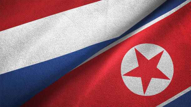 istock North Korea and Netherlands two flags together textile cloth, fabric texture 1125772936