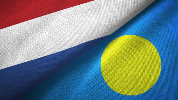 istock Palau and Netherlands two flags together textile cloth, fabric texture 1125772937