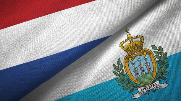 istock San Marino and Netherlands two flags together textile cloth, fabric texture 1125772960