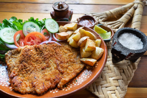 traditional milanese beef and french fries - milanese imagens e fotografias de stock