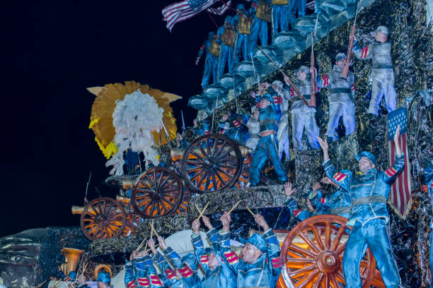 Brazilian men wearing soldiers costumes standing on a float parade representing the American Civil War at the Sambodromo (Sambadrome) during 2017 Rio de Janeiro Carnival. The Sambodromo is located in the downtown zone of Cidade Nova and it is the official venue of the Rio Carnival where the School parades take place. It was designed by famous brazilian architect Oscar Niemeyer. Every year the Carnival attract lots of thousands of Brazilians and foreign tourists from all over the world.