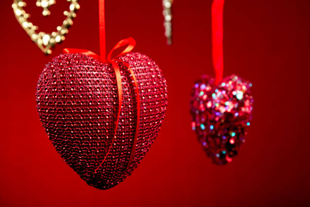 Decorative red hearts hanging on the ceiling of a cafe