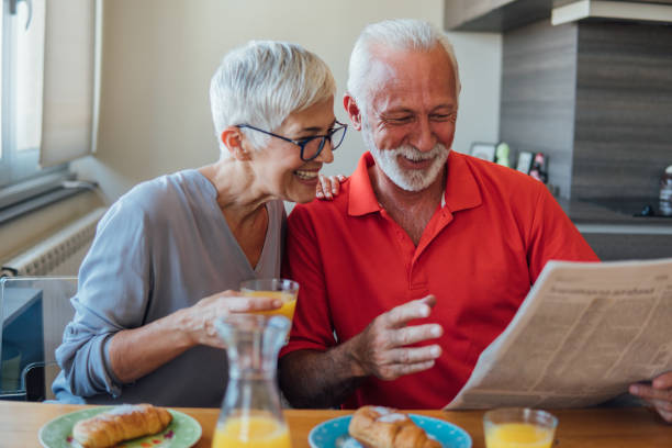 istock Senior couple reading newspapers 1125775815