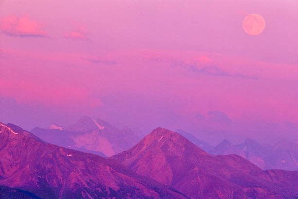 View of Victoria cross Range with moon rise at sunset in Jasper National Park, Canada