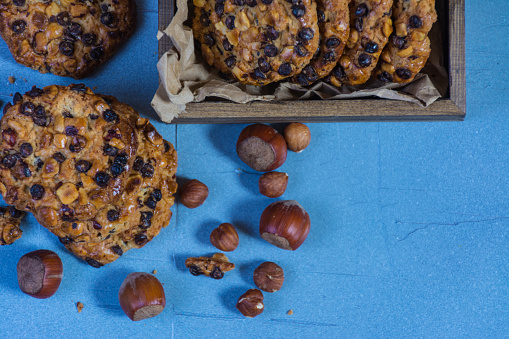 oats cookies with hazelnuts and chocolate chips, a box with cookies and a cloth