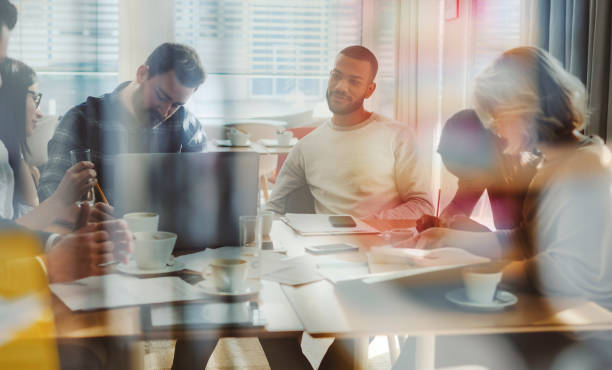 istock Business people brainstorming in office cafeteria 1125784463