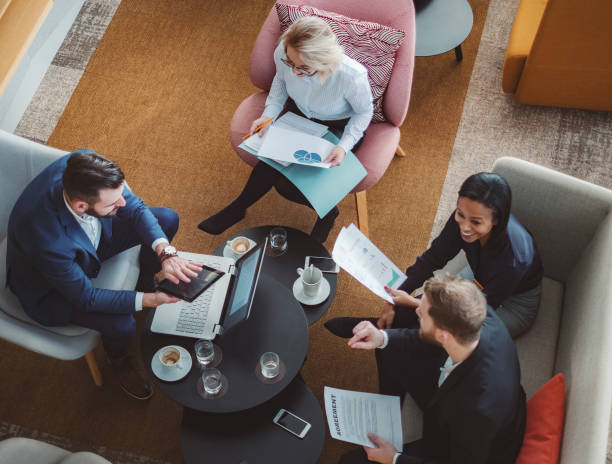 istock Group of business people in office cafeteria 1125784535