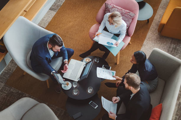 istock Group of business people in office cafeteria 1125784565