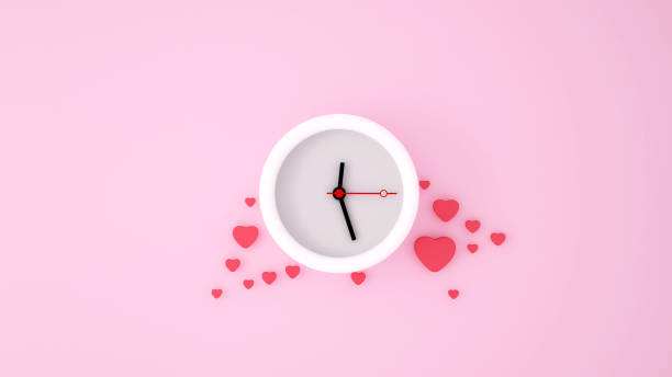 istock White clock and red heart on a pink background. 3D Illustration 1125784707