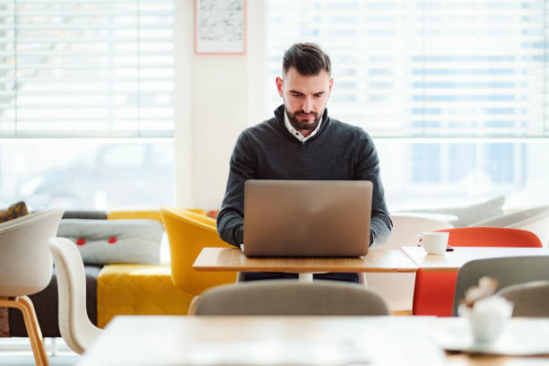 istock Man in the office cafeteria in the morning 1125784751