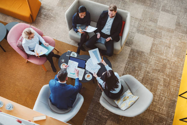 istock Group of business people in office cafeteria 1125784792