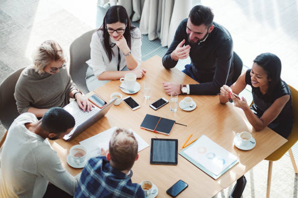 istock Group of business people in office cafeteria 1125785330
