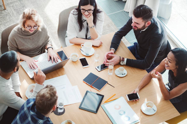 istock Group of business people in office cafeteria 1125785430