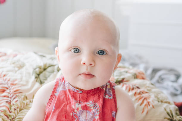 istock Adorable Bald Little baby with blue eyes 1125785906