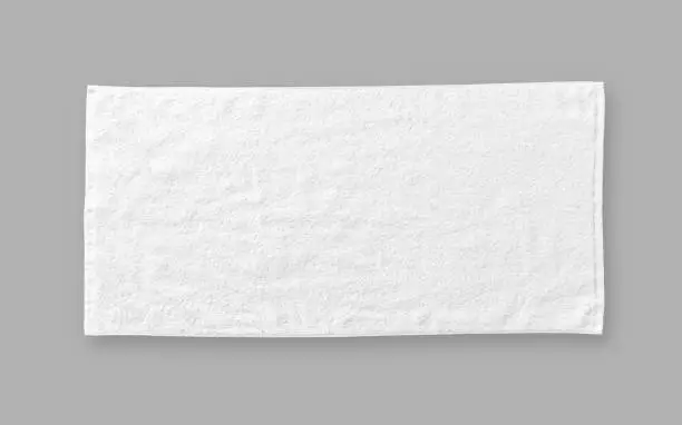 Photo of White cotton towel mock up template fabric wiper isolated on grey background with clipping path, flat lay top view