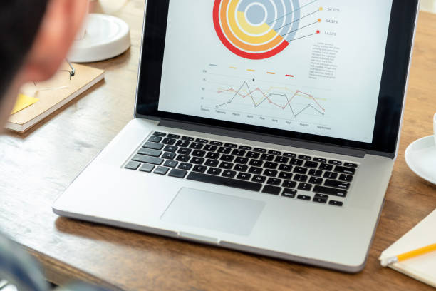 istock Laptop with business graph on display 1125786260