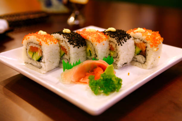 istock Uramaki rolls with tuna and salmon served on a white plate. Beijing, China 1125786521
