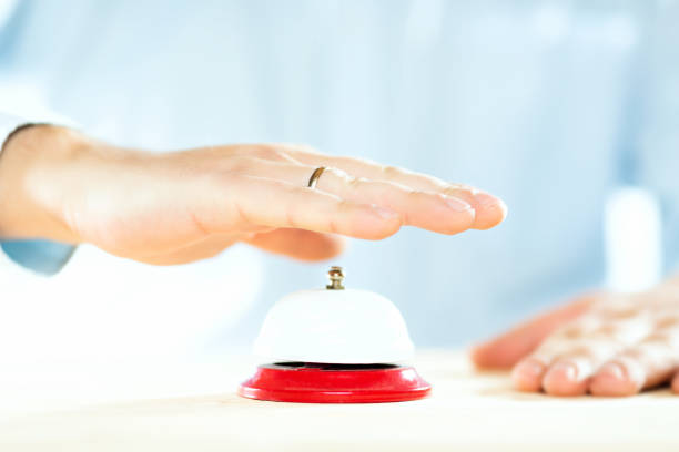 istock Service concept. Businessman hand above red hotel service bell. 1125788438