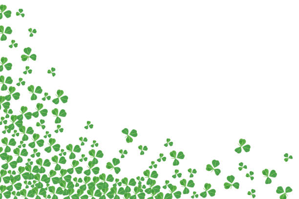 St Patricks Day corner border of shamrocks over a white background