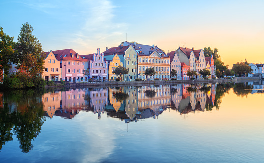 Landshut Old Town, Bavaria, Germany, traditional colorful gothic houses reflecting in Isar river on sunrise