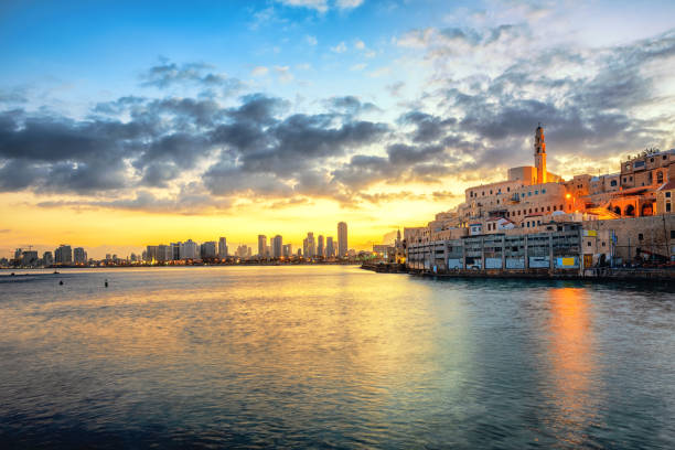 Jaffa Old Town and Tel Aviv skyline on sunrise, Israel Jaffa Old Town and modern Tel Aviv skyline on dramatic sunrise, Israel tel aviv photos stock pictures, royalty-free photos & images