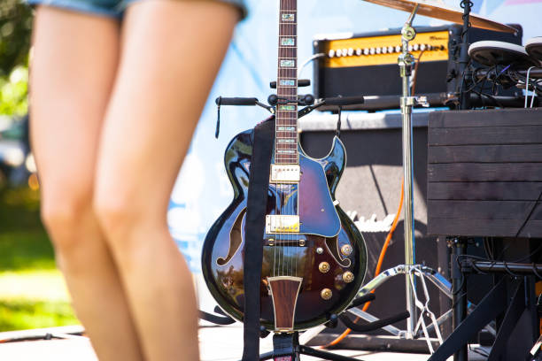 istock semi-acoustic guitar on a stand on stage 1125790967