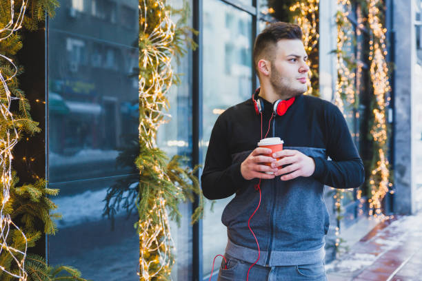 istock Young man walking on the street 1125797862