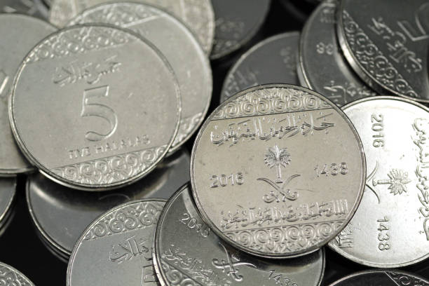 istock A pile of Saudi Arabian five halala silver coins 1125799005