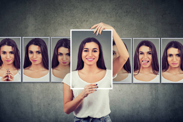 istock Masked young woman expressing different emotions 1125799977