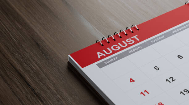 istock Red August 2019 Calendar On  Brown Wood Surface 1125801137