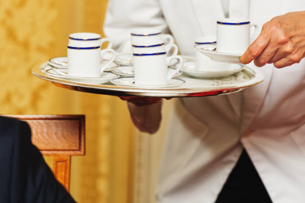 istock Waiter carrying tray with coffee cups on some festive event, party or wedding reception 1125801233
