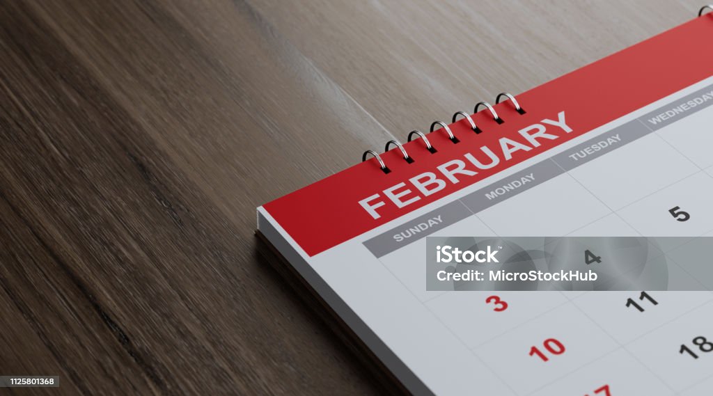 Red February 2019 Calendar On  Brown Wood Surface Red February 2019 calendar on brown reflective wood surface. Horizontal composition with copy space. Calendar and reminder concept with selective focus. 2019 Stock Photo