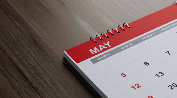 istock Red May 2019  Calendar On  Brown Wood Surface 1125802087