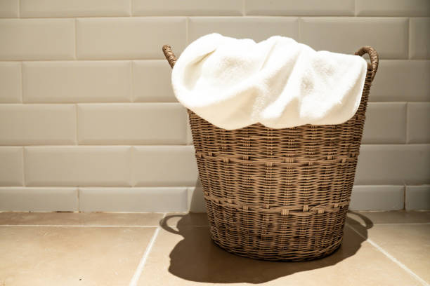 istock used towel in basket on the floor. 1125808317