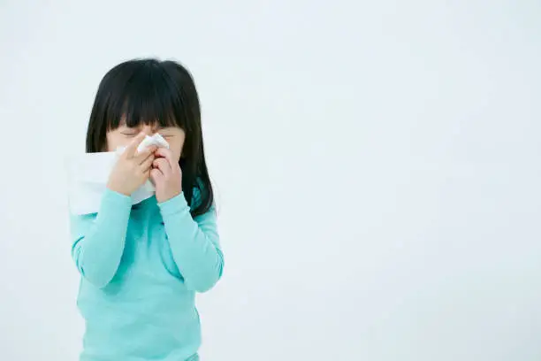 Photo of Korean girl blowing nose