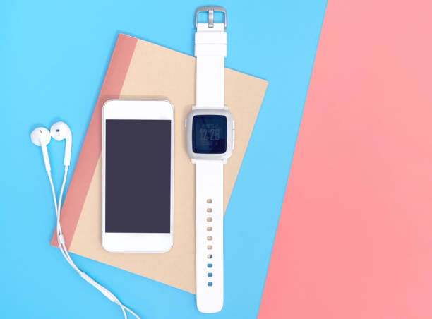 istock Empty mobile phone with smartwatch gadgets on blue
