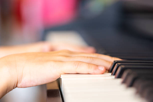istock Children Hand is playing Music keyboard Piano 1125809931