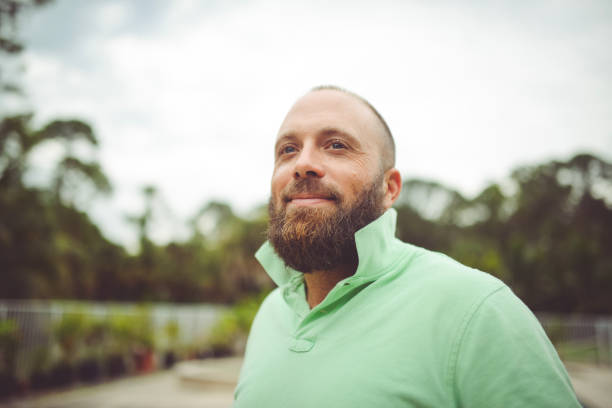istock Handsome man with a beard outdoors in a polo shirt 1125813989
