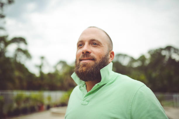 istock Handsome man with a beard outdoors in a polo shirt 1125814290