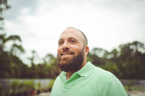 istock Handsome man with a beard outdoors in a polo shirt 1125814320