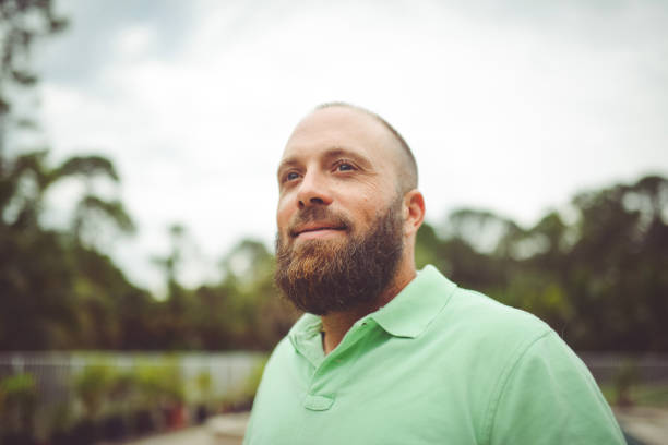 istock Handsome man with a beard outdoors in a polo shirt 1125814321
